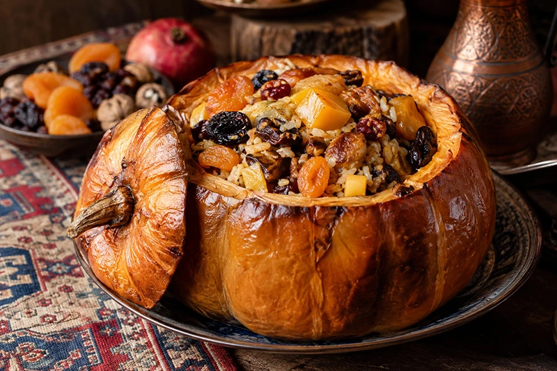 Armenian ghapama, a baked pumpkin filled with rice and dried fruit