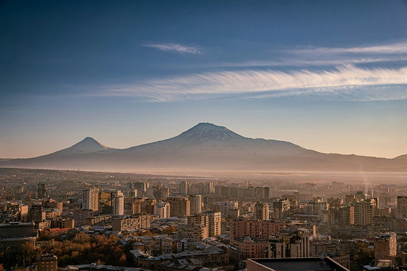 People enjoying an outdoor café in Yerevan on an autumn evening
