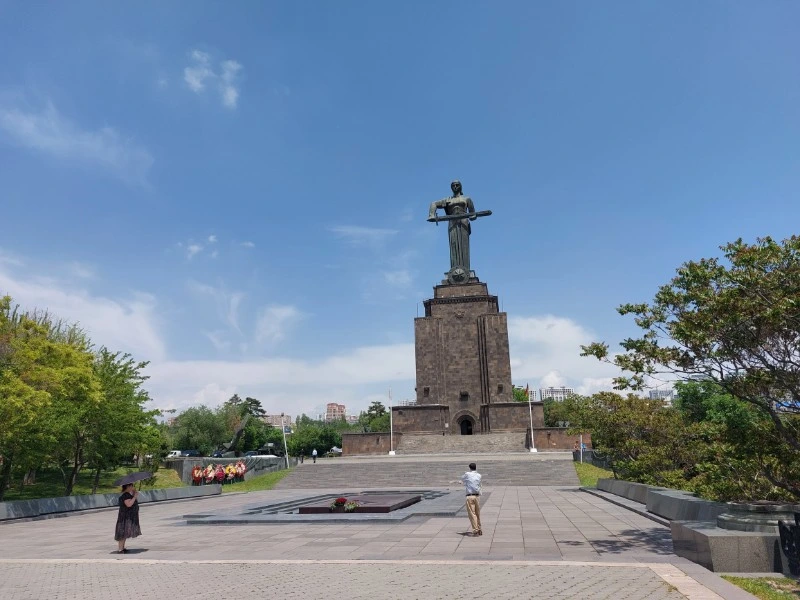 Tourists exploring Yerevan Victory Park.